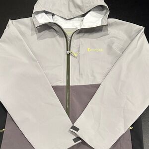 cotopaxi Cielo Two-Tone Hooded Rain Jacket in Light Gray and Charcoal